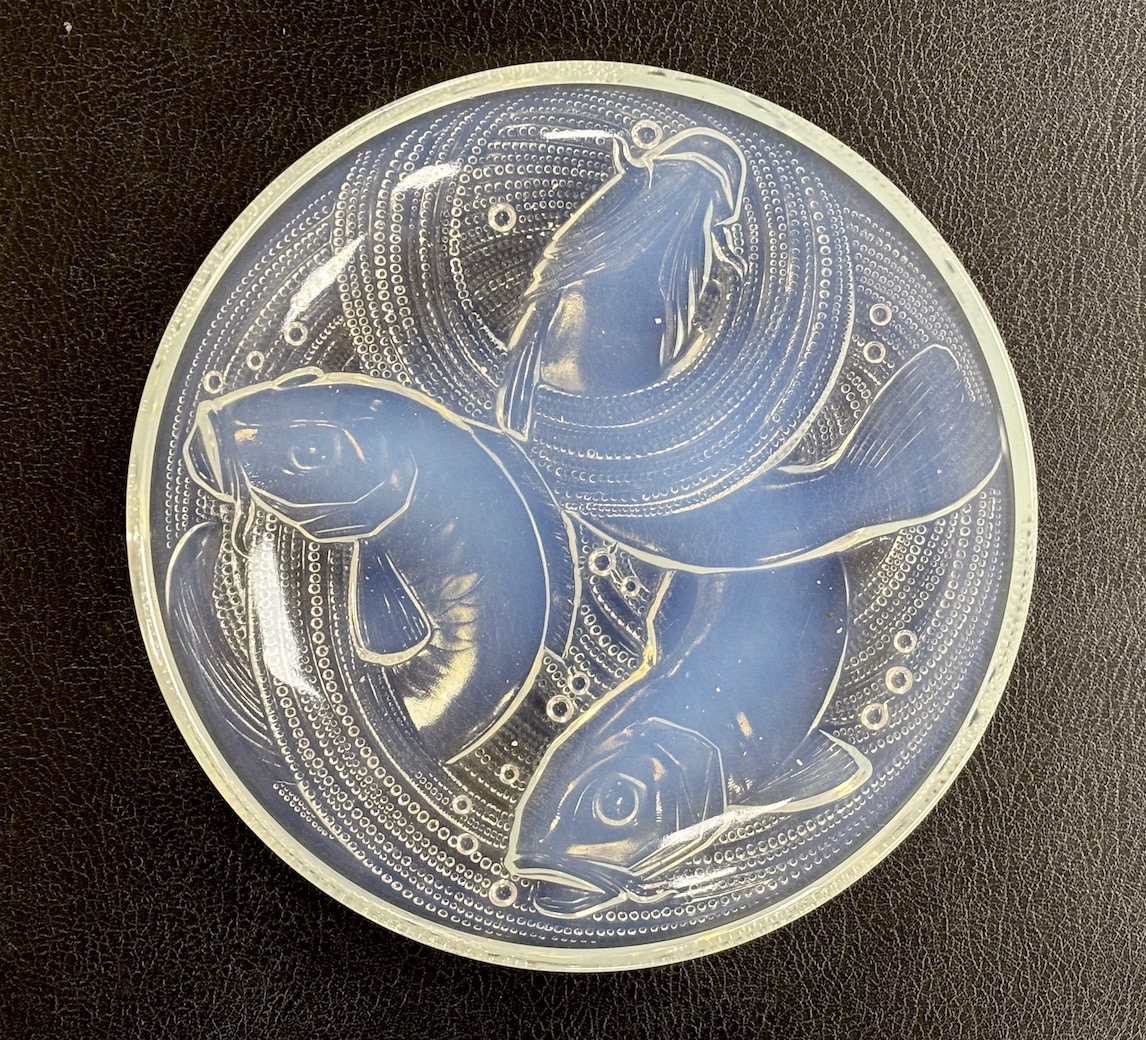 Pierre D'Avesn - a Lalique style opalescent glass dish, moulded in relief with three carp among waves, 30cm diameter